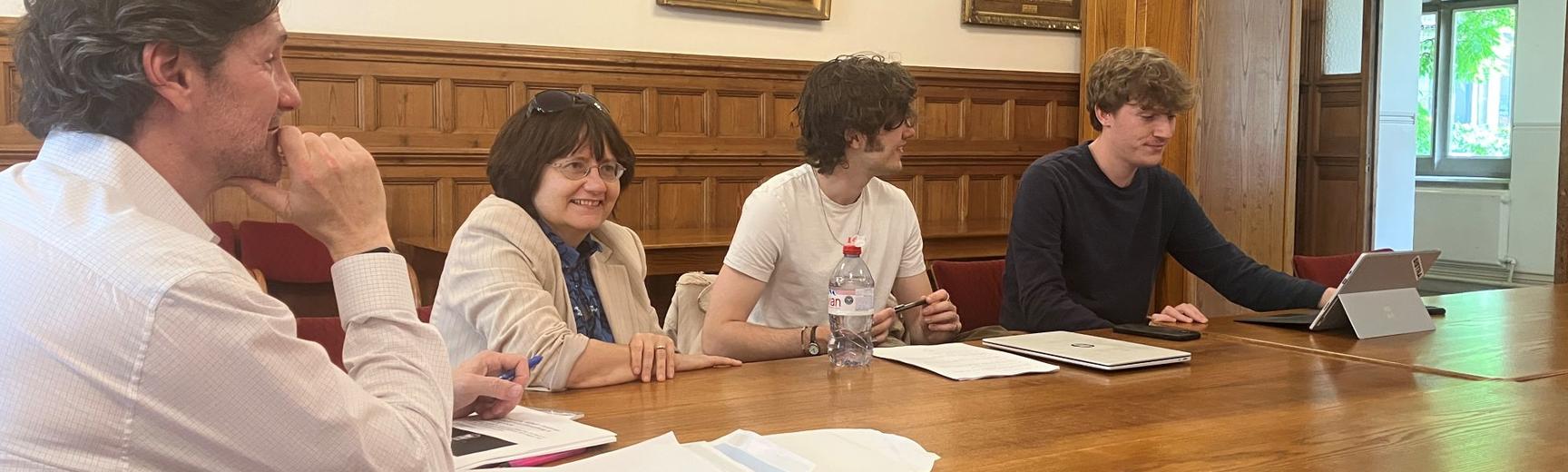 Mike Chessler with students around a desk