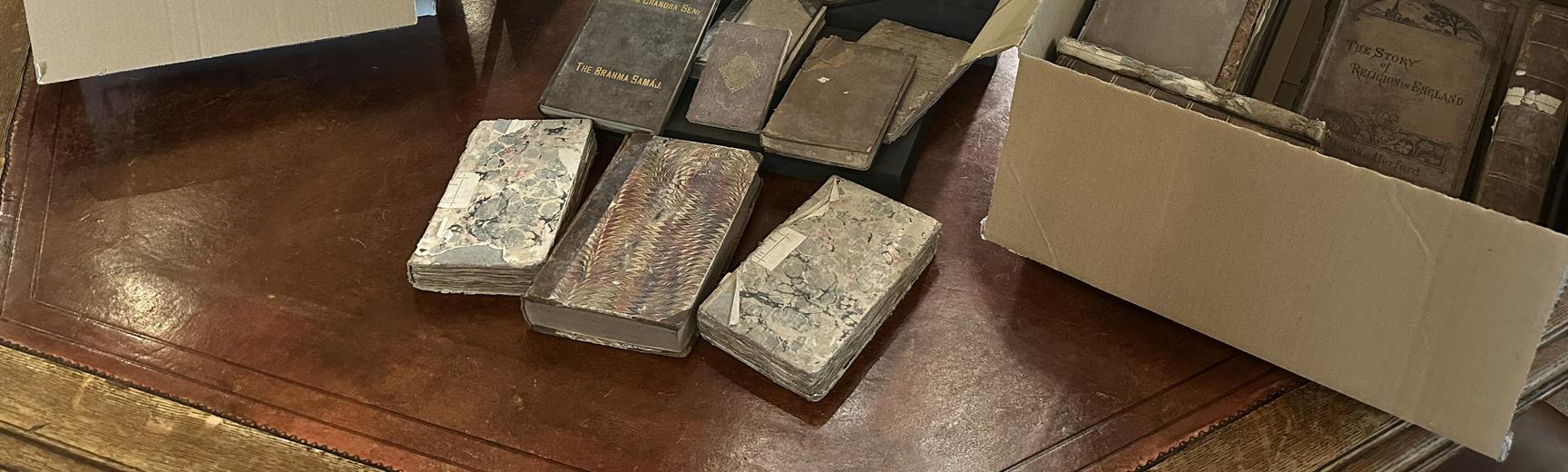 A selection of books laid out on a table