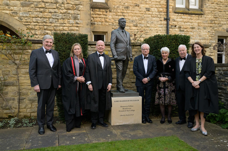 Photo of Lord Smith and Lord Hague with others in front of statue of Lord Harris