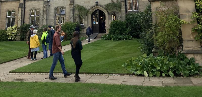 Visitors to the College walking in the Tate Quad