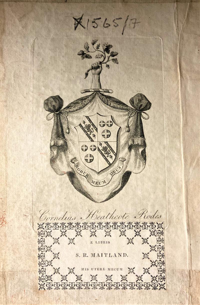 Two bookplates are shown, one above the other.  The bookplates are different, one being a shield shape and more decorative and the other plain.