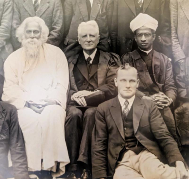 Tagore jacks and radhakrishnan A detail of a photograph showing four figures. Three are seated next to each other on chairs and show from left to right, a man with a white beard and white robes, and two men in suits and academic gowns, one wearing a turban.