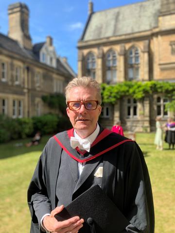 Chris Wheeler in graduation gown