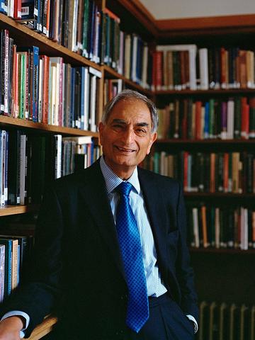 Rajesh Thakker in a room with book shelves