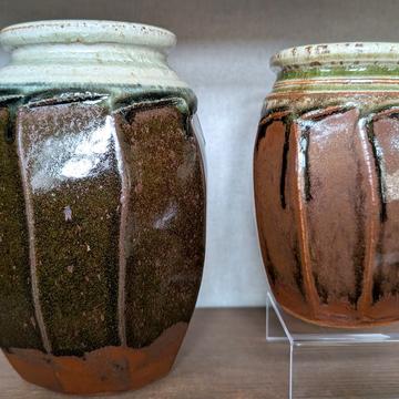 Two jars with brown glaze, same shape but different sizes