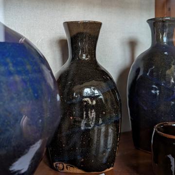 Three dark glazed pots