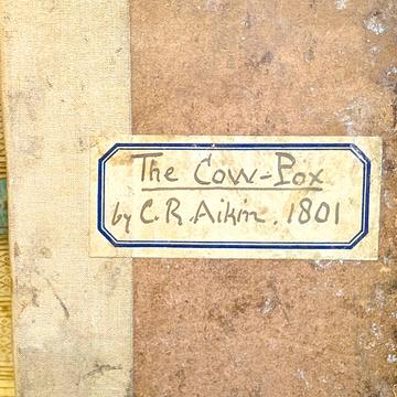 Cow pox cover A cover of book with the title handwritten saying The Cow-Pox by C.R. Aikin 1801