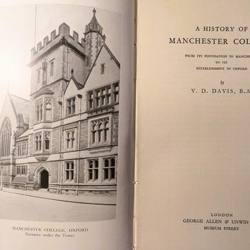 The open pages of a book with a black and white photograph of the college on the left side with the title A history of Manchester College on the right