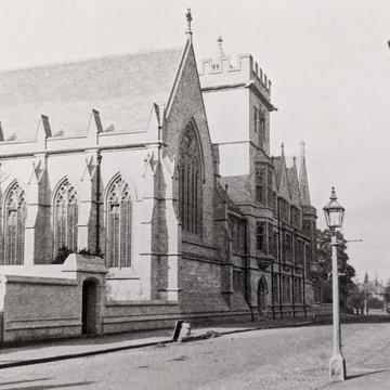 Hmc 1890s A black and white photograph of a street scene with the College buildings to the left