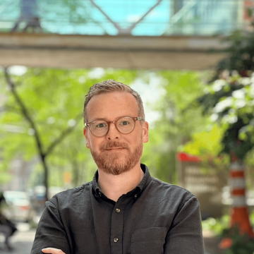 A man standing with arms crossed