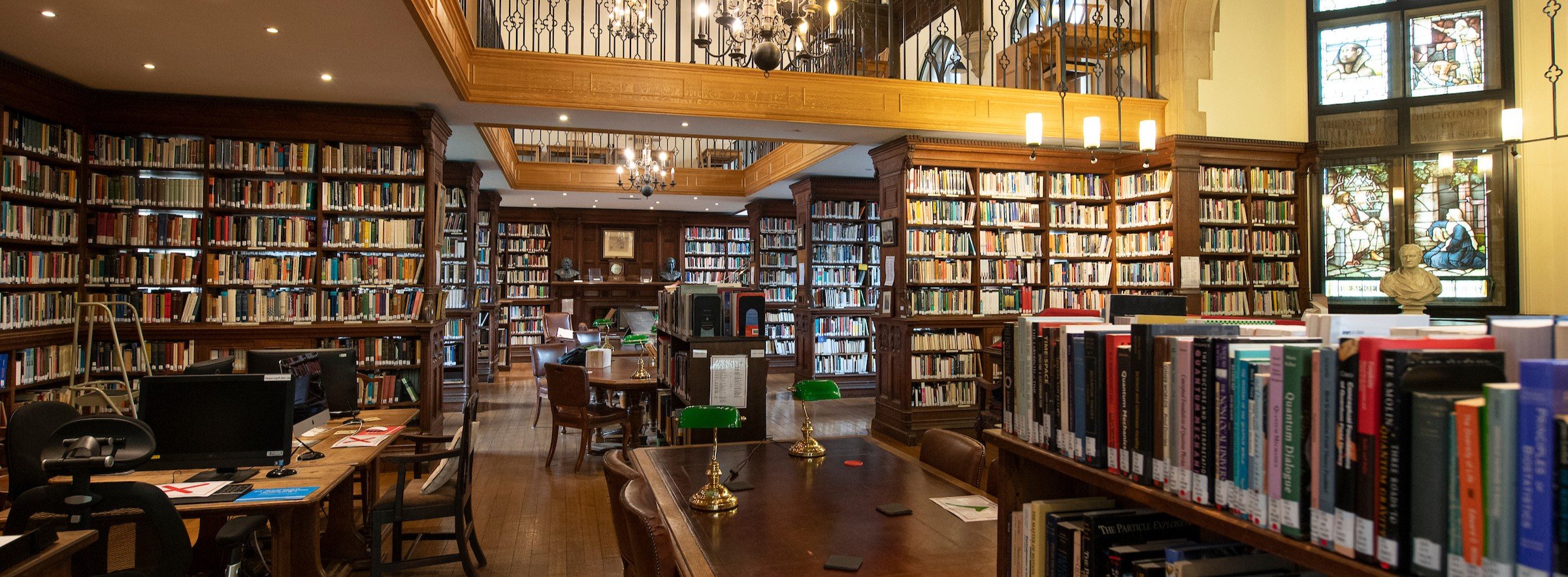 Library shelves with gallery in the background