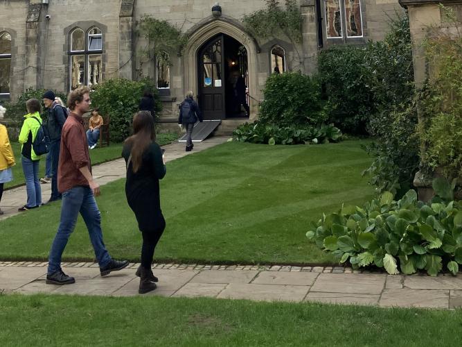 Visitors to the College walking in the Tate Quad