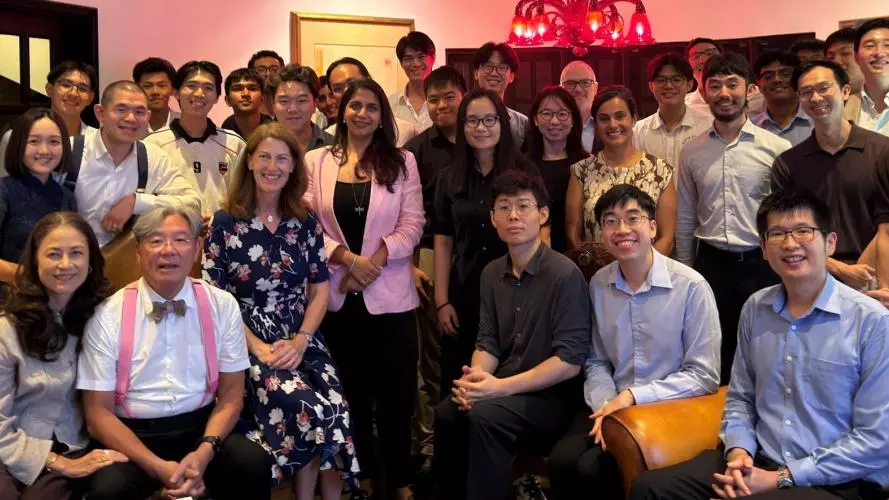 Beth Breeze and Isabel Ruiz with a group of Singapore alumni