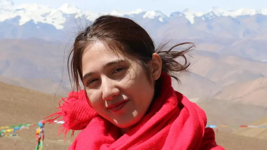 Jay Mok with mountain range in the background