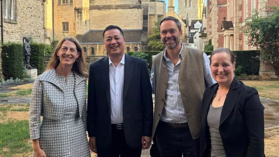 Wilson Sea, Beth Breeze, Jan-Emmanuel De Neve and Bethany Sollereder in the College grounds