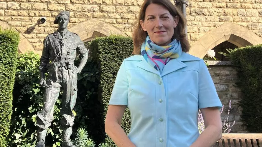 Beth Breeze in front of statue