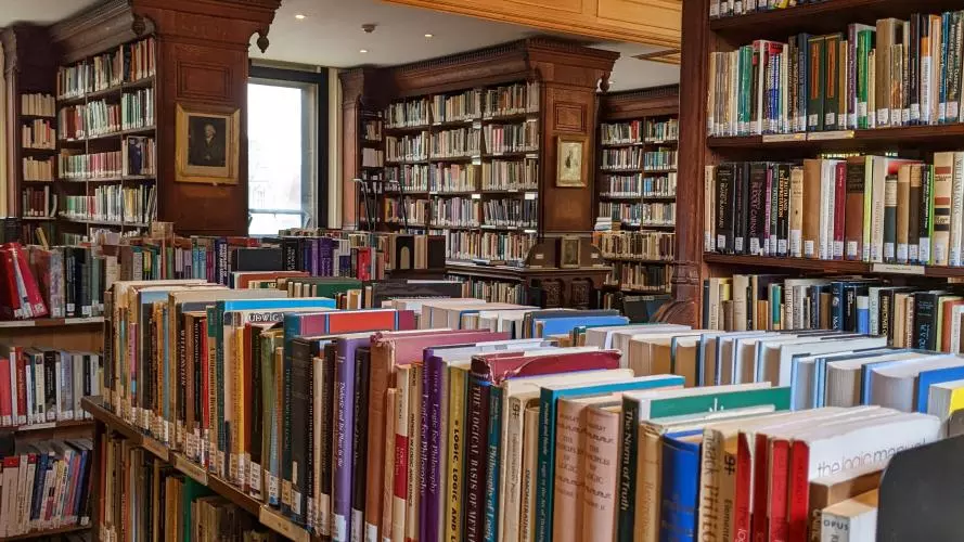Photo of shelves of books in the Tate Library
