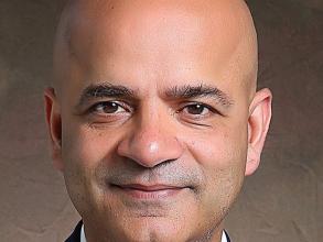 Headshot of a man in a suit