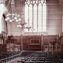 Photograph of the College Chapel with plain glass and individual chairs rather than pews