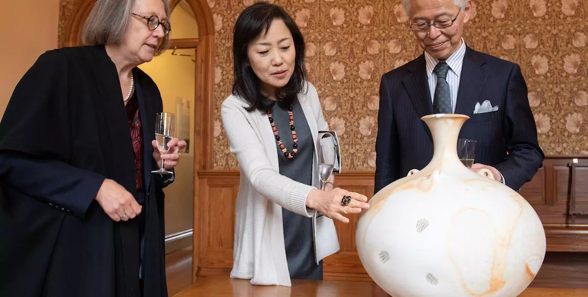 Ambassador and Madamme Hayashi with the Principal admiring Peter Sparrey's stoneware pot.  
