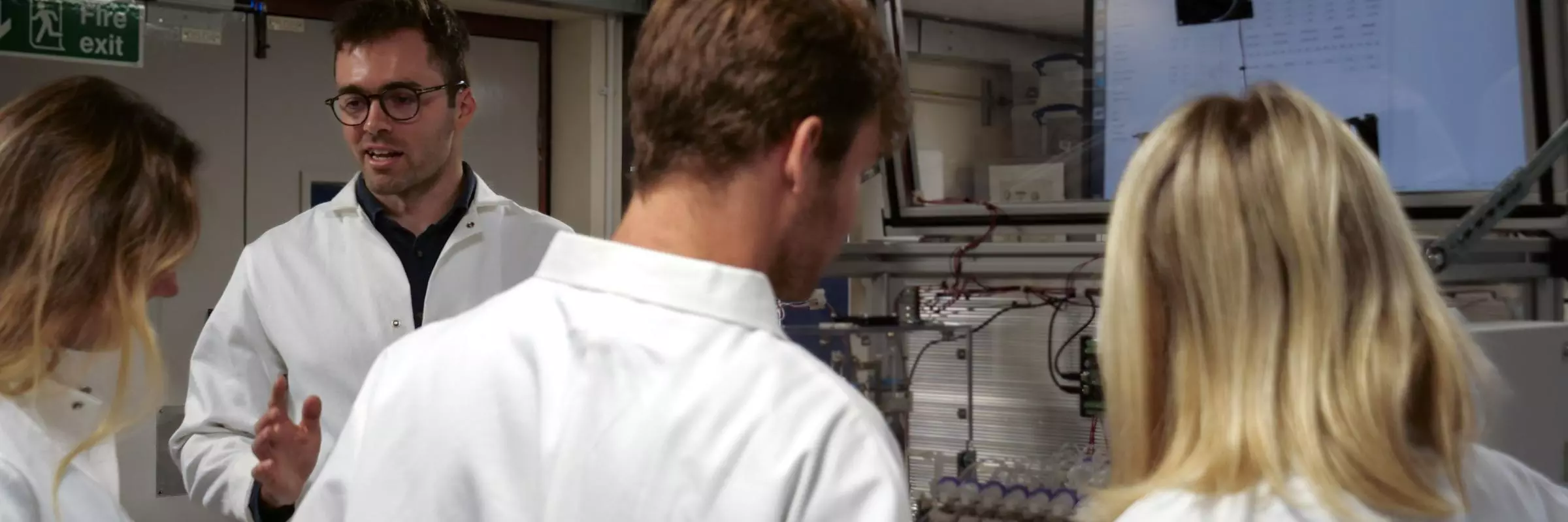 Group of people wearing lab coats