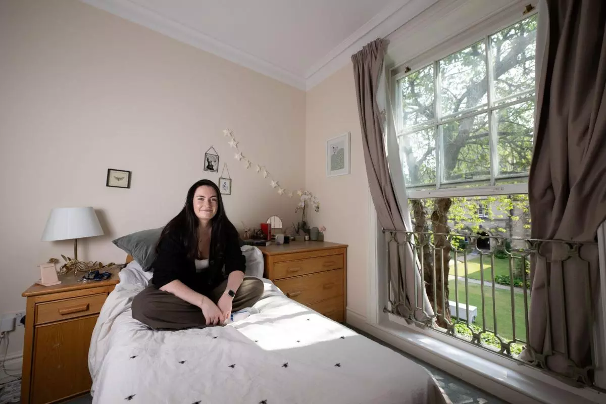 A student in her bedroom