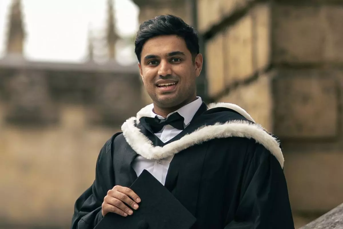 HMC student Hamza in academic gown