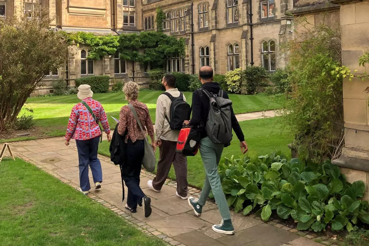 People walking through the College grounds