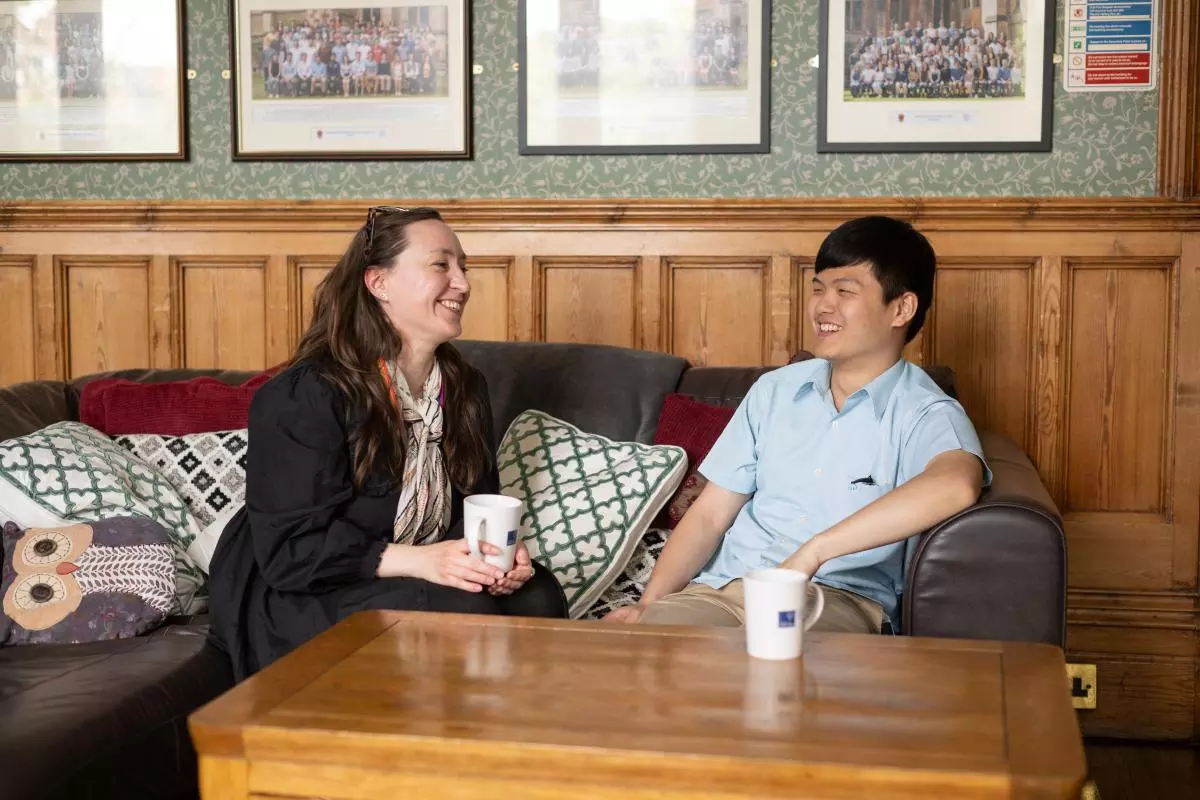 Man and woman sat on sofa